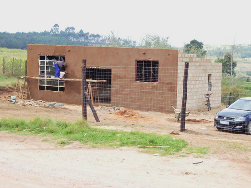 home with a stucco/mud type of brick cover.